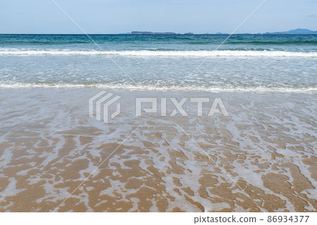 Shikajima: Sunny beach scenery of the Genkai Sea 86934377