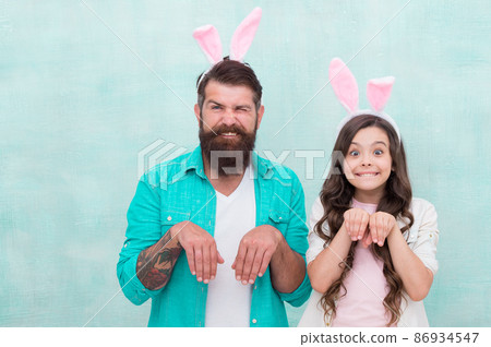 Father and daughter in bunny ears. hunting colorful eggs. Father and daughter in bunny ears. hunting colorful eggs. 86934547