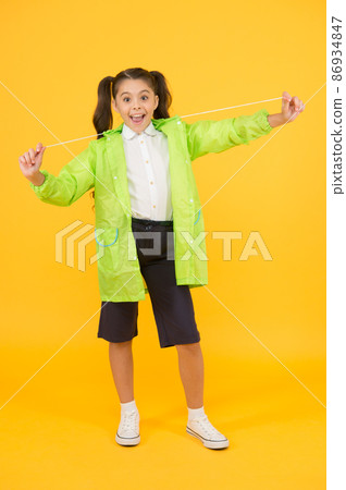 Invest in durable kids rainwear to keep children  86934847