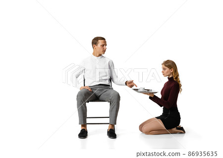 Infringement of rights, gender inequality. Two office workers in business suits in action isolated on white background. 86935635