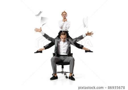 Two stylish office workers in business suits in action isolated on white background. Art, beauty, fashion and business concept Two stylish office workers in business suits in action isolated on white background. Art, beauty, fashion and business concept 86935678