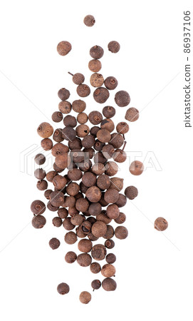 Allspice pile isolated on white background. Jamaican pepper, pimento berry, allspice peppercorns or myrtle pepper. Top view. Allspice pile isolated on white background. Jamaican pepper, pimento berry, allspice peppercorns or myrtle pepper. Top view. 86937106