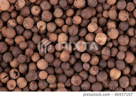 Allspice background. Jamaican pepper, pimento berry, allspice peppercorns or myrtle pepper. Allspice background. Jamaican pepper, pimento berry, allspice peppercorns or myrtle pepper. 86937107