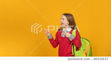 happy kid pointing finger on yellow background. september 1. happy childhood. happy kid pointing finger on yellow background. september 1. happy childhood. 86938637