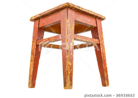 Old wooden stool with brown peeling paint. Loft style chair isolated on a white background. Old wooden stool with brown peeling paint. Loft style chair isolated on a white background. 86938683