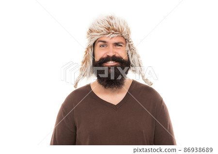 smiling brutal hipster with beard in earflape hat isolated on white background, casual smiling brutal hipster with beard in earflape hat isolated on white background, casual 86938689