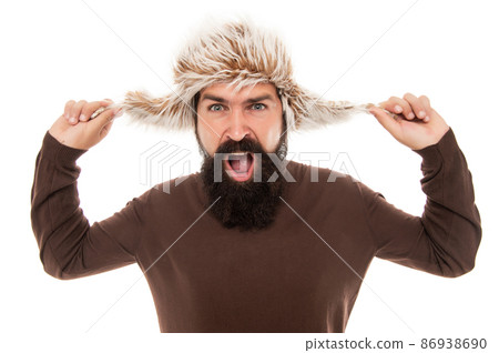 mens beauty. shouting man portrait. mature man with beard in earflap hat. beard hair care. 86938690