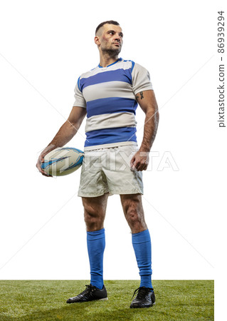 Portrait of serious man, rugby player posing with ball isolated on white background. Concept of action, motion, sport, hobby, ahievements Portrait of serious man, rugby player posing with ball isolated on white background. Concept of action, motion, sport, hobby, ahievements 86939294