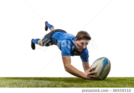 In action. Male rugby player catching ball in jump isolated on white background. Jump and action concept. an incredible strain of all forces In action. Male rugby player catching ball in jump isolated on white background. Jump and action concept. an incredible strain of all forces 86939318