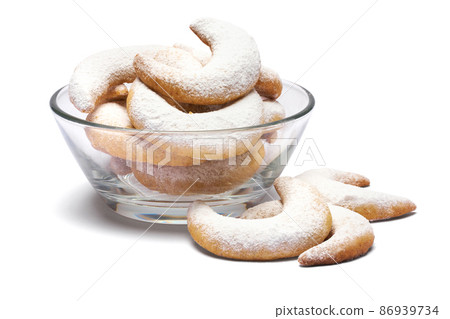 Traditional German or Austrian Vanillekipferl vanilla kipferl cookies in glass bowl Traditional German or Austrian Vanillekipferl vanilla kipferl cookies in glass bowl 86939734
