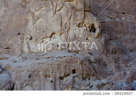 surface structure of brown shades of natural stone outdoors in nature 86939987