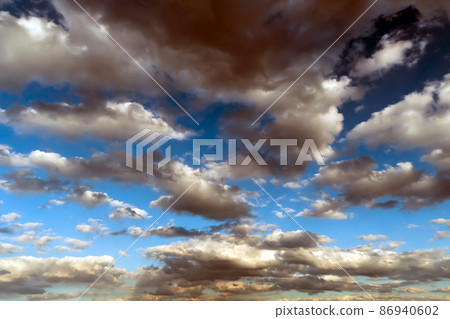Panoramic view of the blue sky with clouds in motion. View of the blue sky with clouds in motion.Nice weather with clear skies.Heavenly Light.Dramatic sky with clouds Panoramic view of the blue sky with clouds in motion. View of the blue sky with clouds in motion.Nice weather with clear skies.Heavenly Light.Dramatic sky with clouds 86940602