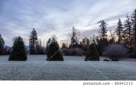 Park in a city neighborhood during a winter sunrise. Park in a city neighborhood during a winter sunrise. 86941213