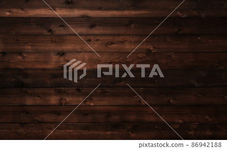 Horizontal background image with dark brown boards with wood grain and knots 86942188