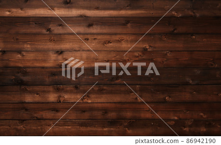 帶有木紋和結的黑褐色板的水平背景圖像 86942190