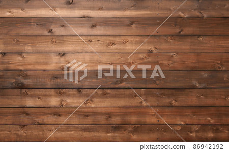 帶有木紋和結的紅褐色板的水平背景圖像 86942192