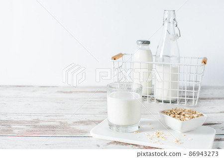 Homemade non dairy alternative milk made from oat flakes. 86943273