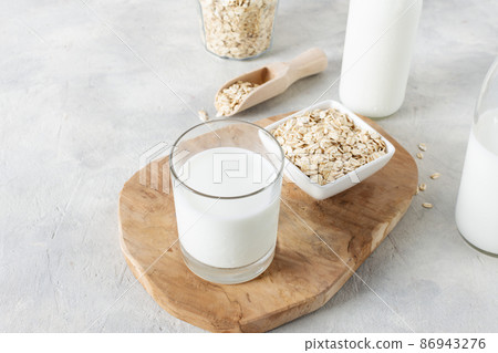 Homemade non dairy alternative milk made from oat flakes. 86943276