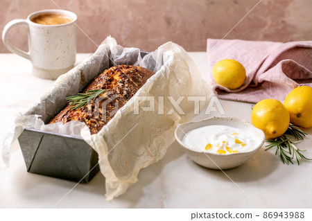 Homemade lemon cake with nuts and rosemary Homemade lemon cake with nuts and rosemary 86943988