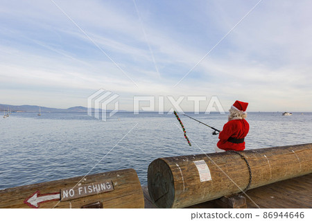 Close up shot of Santa fishing at the shore of Santa Barbara 86944646