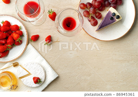 Beautiful composition with strawberry, grapes, cheese and blueberry cheesecake 86945361