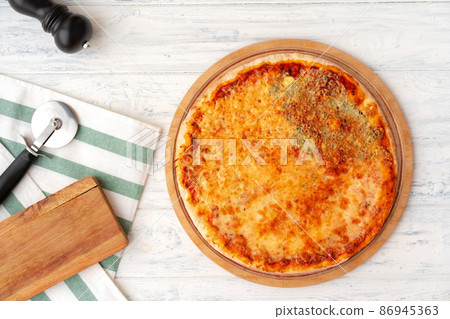 Pizza with four cheeses served on wooden background 86945363