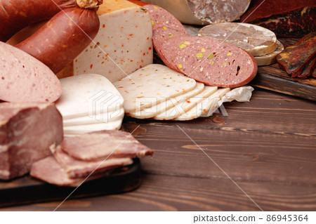 Variety of meat and sausage products on table Variety of meat and sausage products on table 86945364