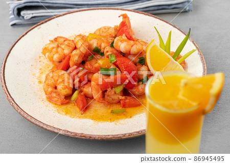 Stir fried seafood with sauce on plate with napkin 86945495