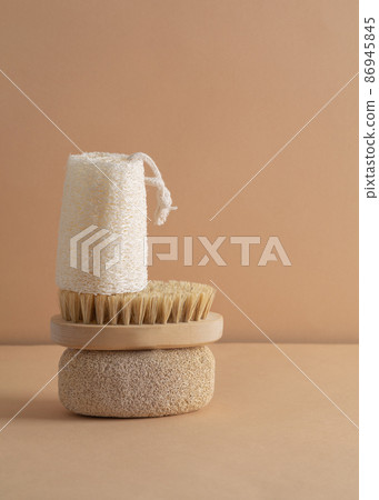 Eco friendly bathroom accessories on beige background. Beauty, sustainable and wellness concept. Vertical Eco friendly bathroom accessories on beige background. Beauty, sustainable and wellness concept. Vertical 86945845