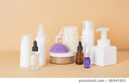 Beauty, spa and wellness concept. Facial cosmetic products, konjac sponge on a beige background. Health and medicine concept, beauty and selfcare. Front view 86945863