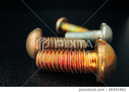 Iron screw bolts on black background close up Iron screw bolts on black background close up 86945962