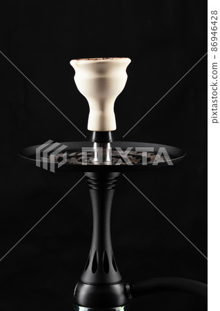 Ceramic tobacco bowl of hookah on black background Ceramic tobacco bowl of hookah on black background 86946428