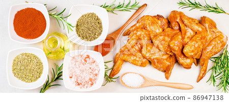 Chicken wings are raw in the marinade. Oven baking wings. Semifinished. Fast cooking.Raw Marinated chicken meat wings for BBQ,Cooking chicken with spices . Grilled chicken wings recipe. Chicken wings are raw in the marinade. Oven baking wings. Semifinished. Fast cooking.Raw Marinated chicken meat wings for BBQ,Cooking chicken with spices . Grilled chicken wings recipe. 86947138