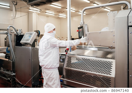 Automated production line with packaging and cutting of meat in modern food factory.Meat processing equipment. Automated production line with packaging and cutting of meat in modern food factory.Meat processing equipment. 86947140