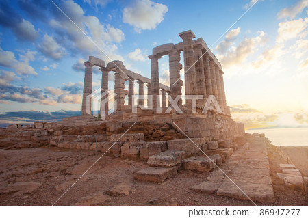 Greek temple ruins on sunset. Tourist landmark of Attica, Sounion, Greece 86947277
