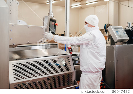 Automated production line in modern food factory. Line for the production of semi-finished meat products.Factory for the production of food from meat.Conveyor Belt Food. 86947422