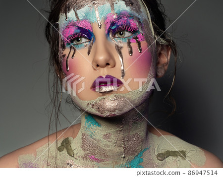 Portrait of woman with creative fashion makeup Portrait of woman with creative fashion makeup 86947514