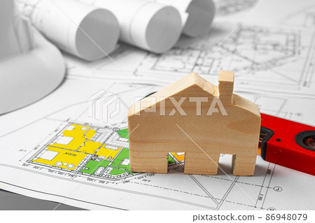 Architectural construction plans paper on table close up Architectural construction plans paper on table close up 86948079