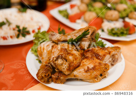Plate with roasted chicken Plate with roasted chicken 86948316