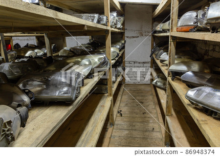 Used headlamp components for sale on the store shelf. Used headlamp components for sale on the store shelf. 86948374