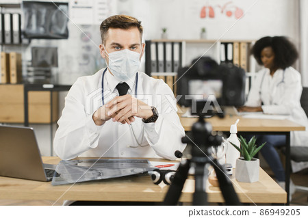 Therapist recording video about protection from face mask Therapist recording video about protection from face mask 86949205