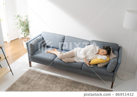 A woman taking a nap A woman taking a nap 86951432