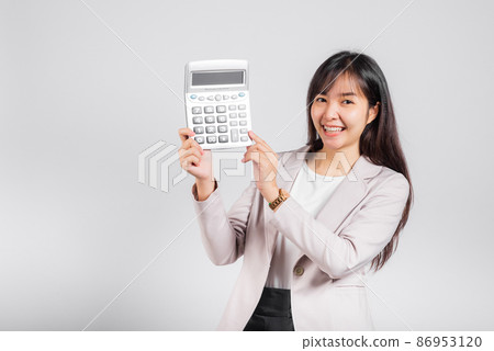 Woman confident smiling holding electronic calculator Woman confident smiling holding electronic calculator 86953120