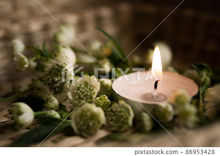 Candles and flowers natural background 86953428