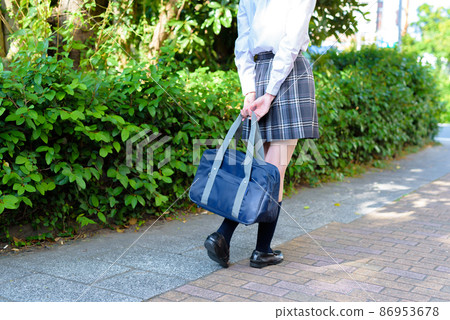 High school girls who go to school with their school bags in their backs, back view, going to and from school, no face High school girls who go to school with their school bags in their backs, back view, going to and from school, no face 86953678