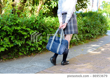 High school girls who go to school with their school bags in their backs, back view, going to and from school, no face High school girls who go to school with their school bags in their backs, back view, going to and from school, no face 86953679