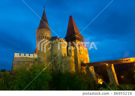 Night landscape with illuminated Corvin Castle, Romania 86955219