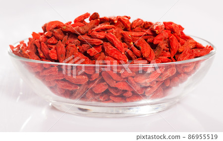 Glass bowl with dried goji berries Glass bowl with dried goji berries 86955519