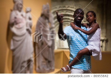 Father and daughter looking at exhibits Father and daughter looking at exhibits 86955642