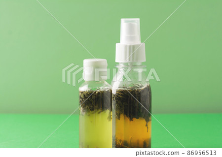 Fermented beauty products with green tea extract, holistic beauty concept, copy space Fermented beauty products with green tea extract, holistic beauty concept, copy space 86956513